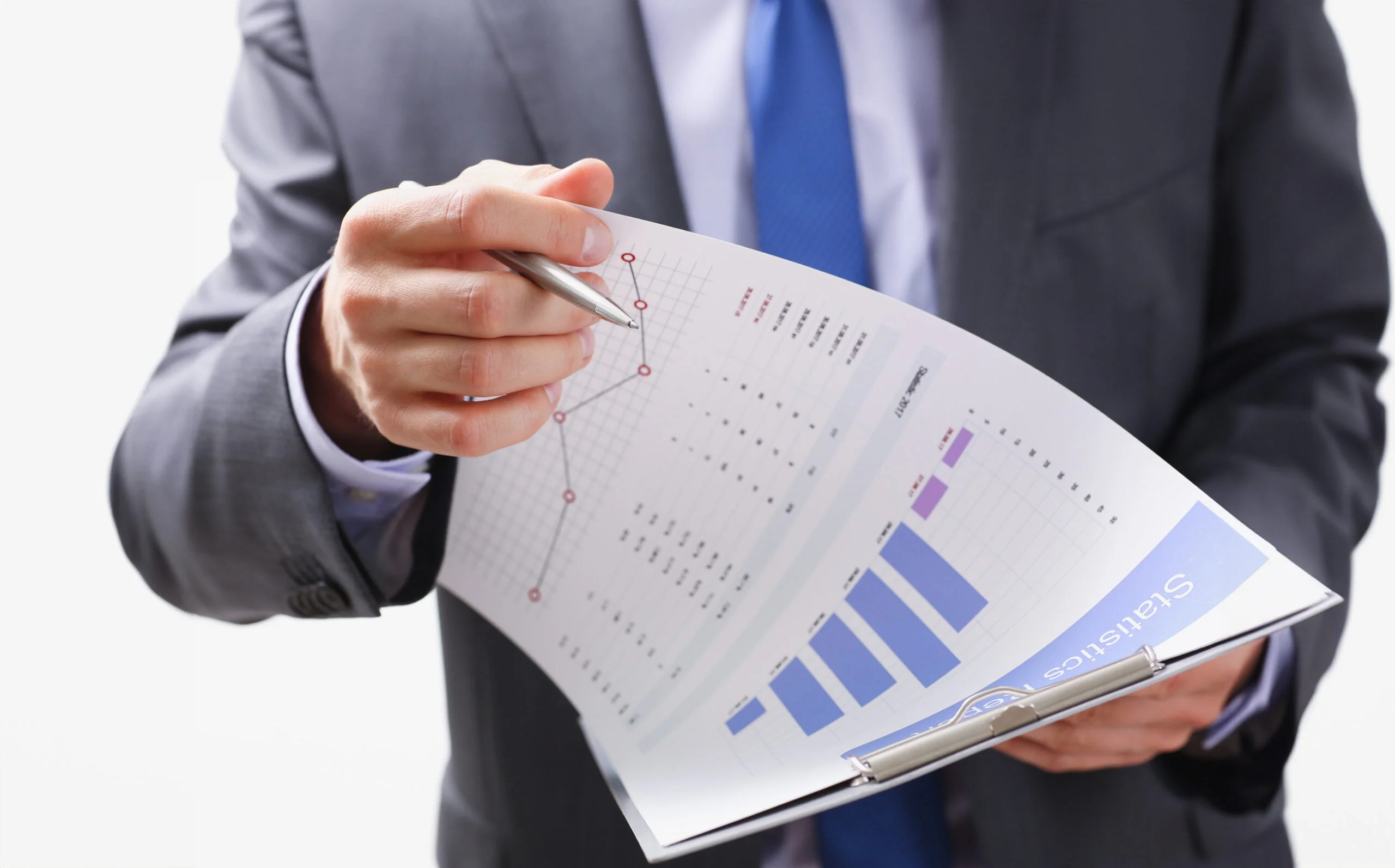 Hand of businessman in suit filling and signing