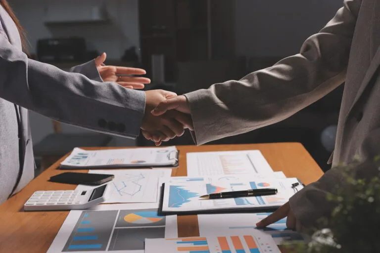 Business handshake for teamwork of business merger and acquisitionsuccessful negotiatehand shaketwo businessman shake hand with partner to celebration partnership and business deal concept