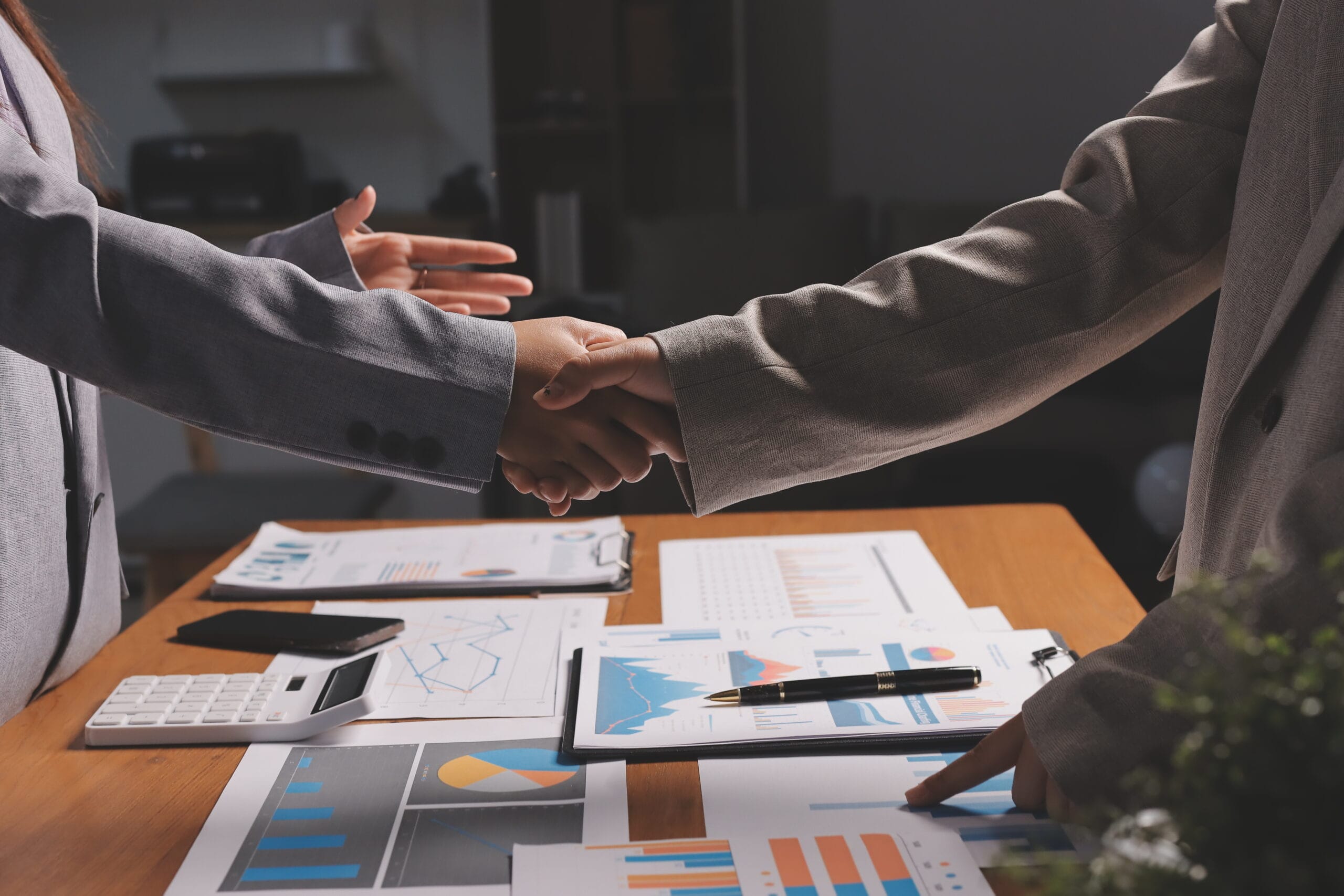 Business handshake for teamwork of business merger and acquisitionsuccessful negotiatehand shaketwo businessman shake hand with partner to celebration partnership and business deal concept